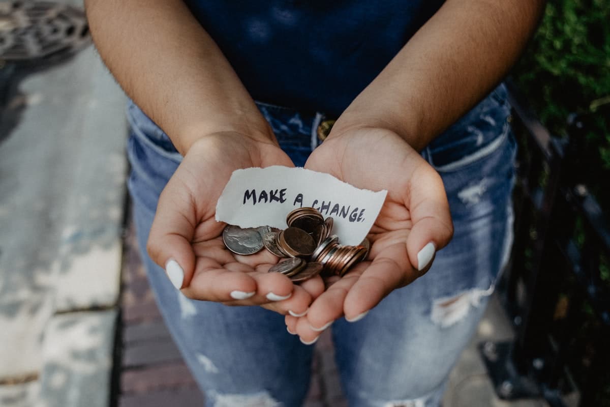 Hands holding a red heart symbolizing charitable giving